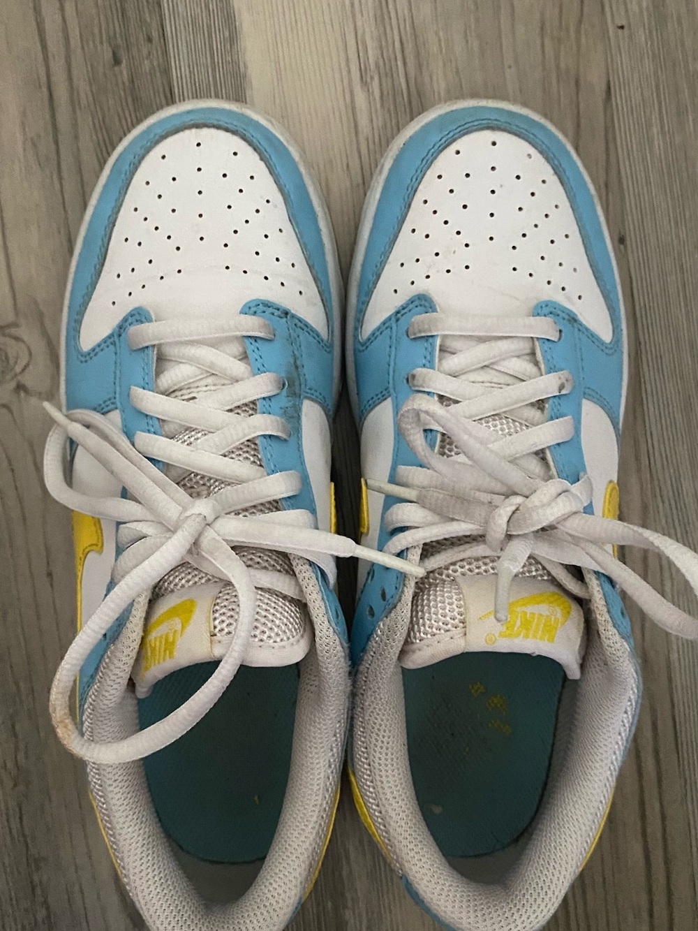 Nike White and Light Blue Low-Top Sneakers with Yellow Accents